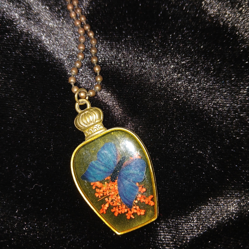 Gold Pendant Necklace with Blue Butterfly Design